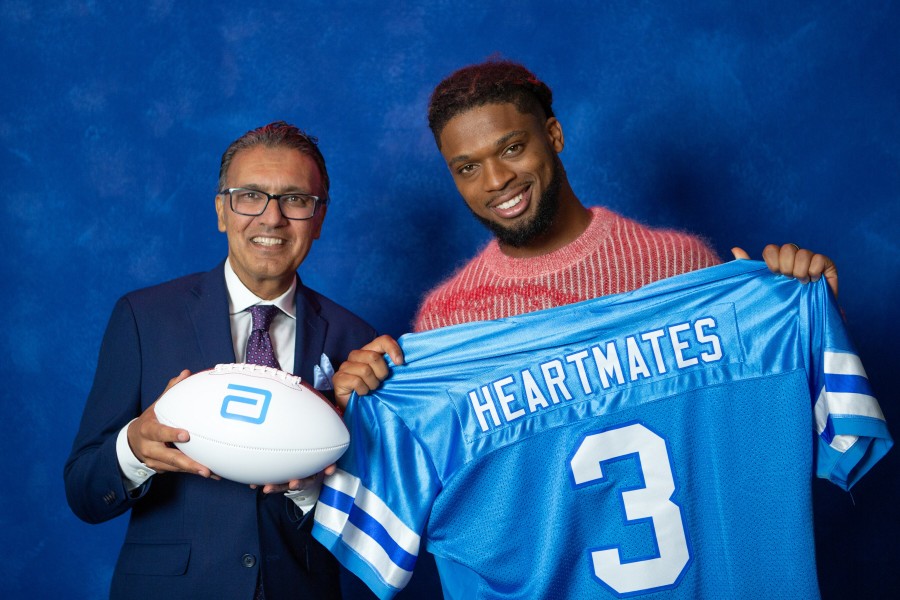 Damar Hamlin (right), professional football player, heart health advocate and Abbott HeartMates Ambassador, with Nadim Geloo, M.D., senior director of medical affairs in Abbott's Structural Heart business.