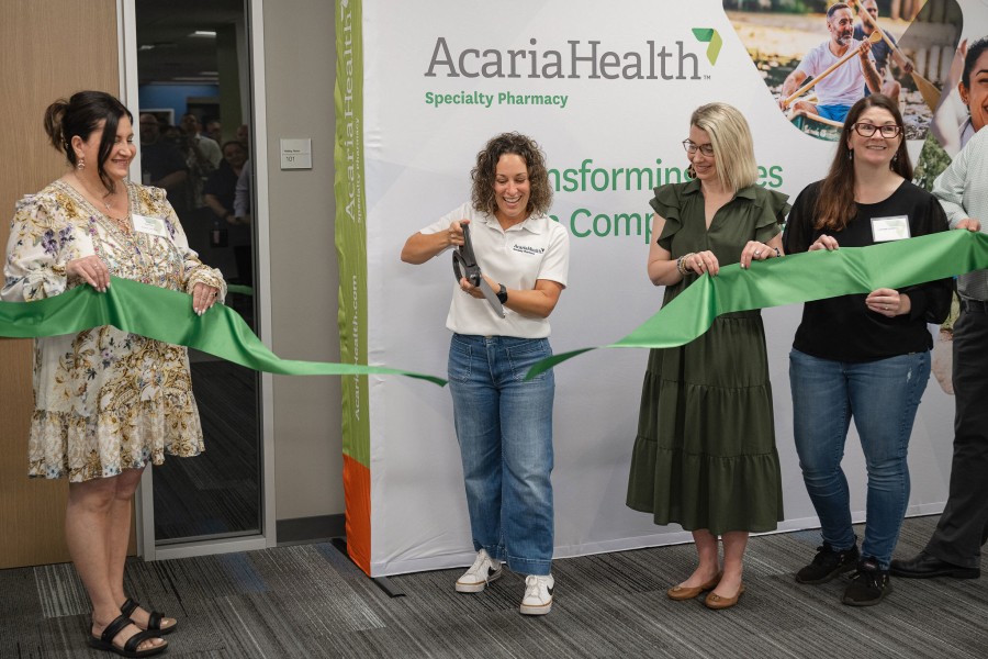 Jessica Ciccolella-Kahl, CEO of AcariaHealth, cuts the ribbon during the grand opening celebration in Shelby Township, Michigan.