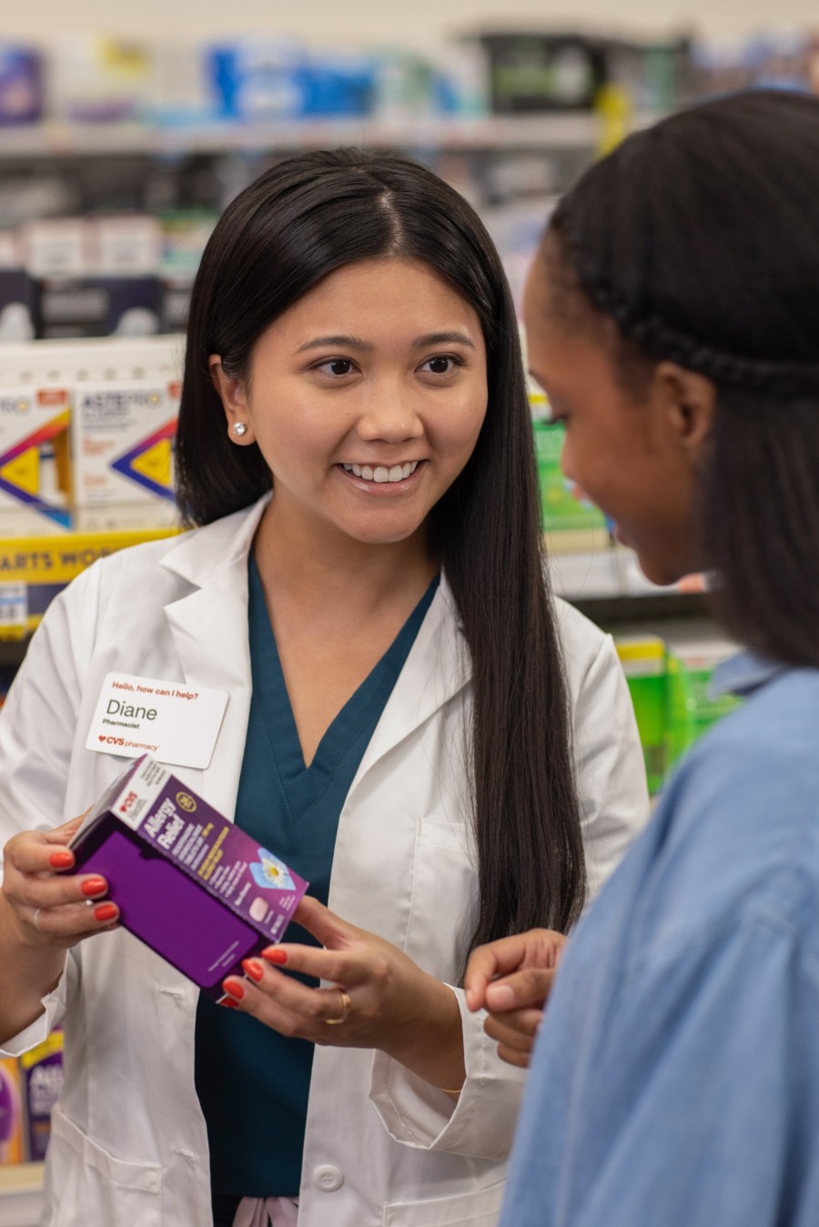 Pharmacist discussing an OTC product with a patient.